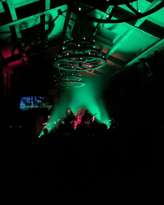 Queenless Kings on stage, green lights