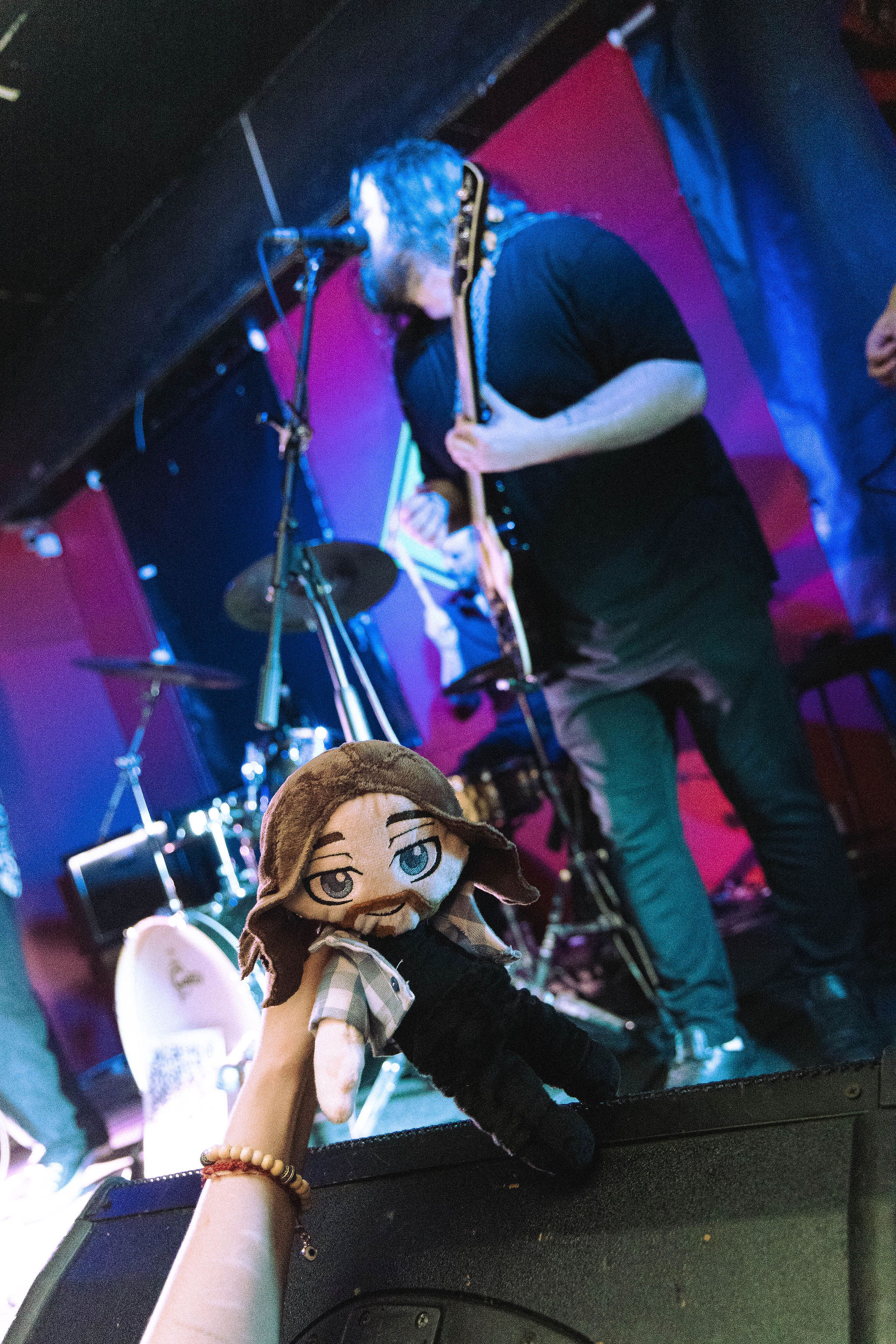 Band member with merch plushie